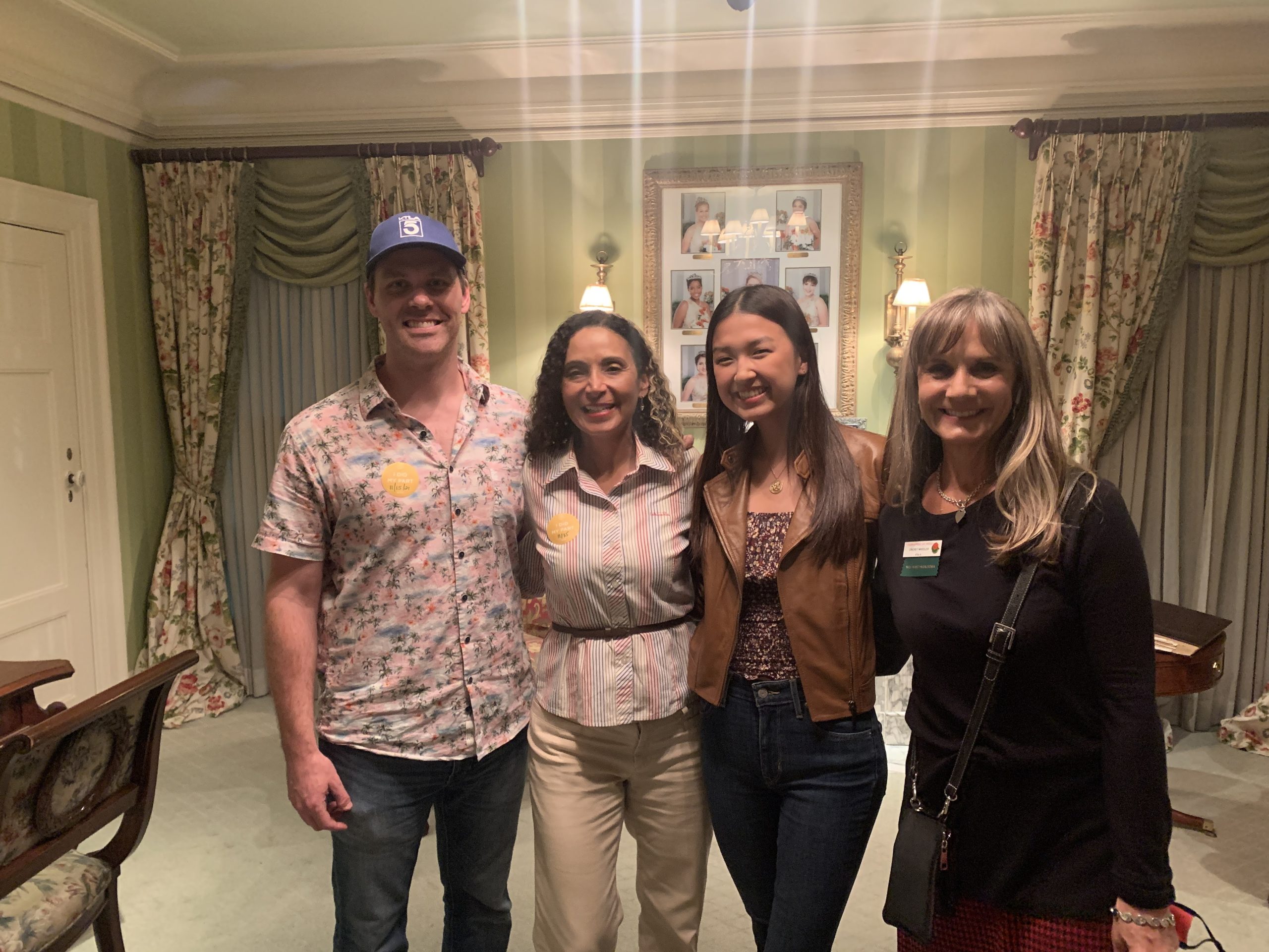 The 2022 Rose Queen Nadia Chung poses with KTLA field production team: field producer Patricia Nazario, show producer Cricket Wheeler and a camera operator.