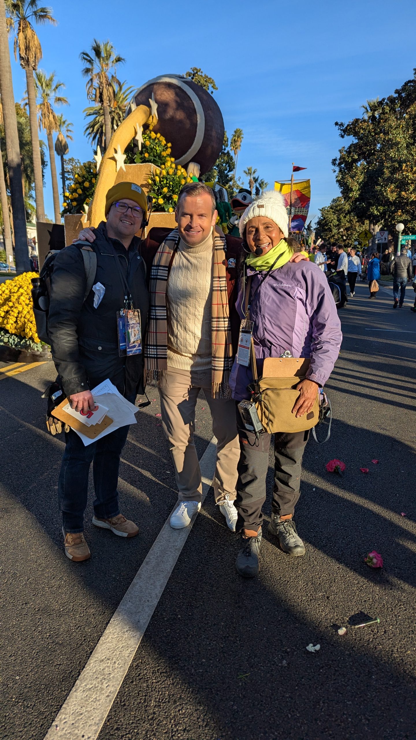 KTLA's Kirk Hawkins poses with field production team, including Patricia Nazario, during the 2025 Rose Parade in Pasadena.