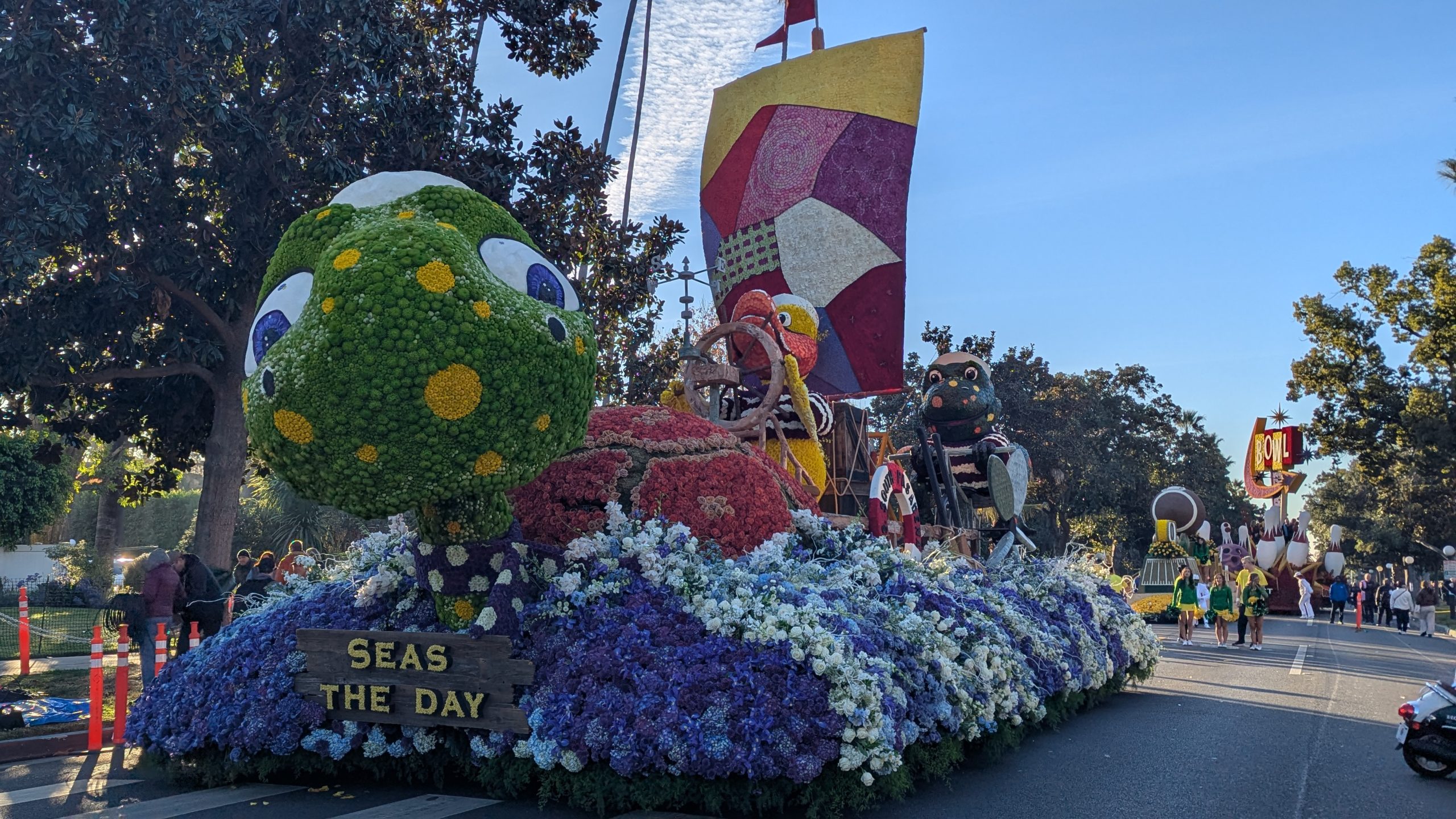 Ocean-themed Rose Parade float featuring a giant sea turtle and colorful floral decorations during the 2025 parade in Pasadena.
