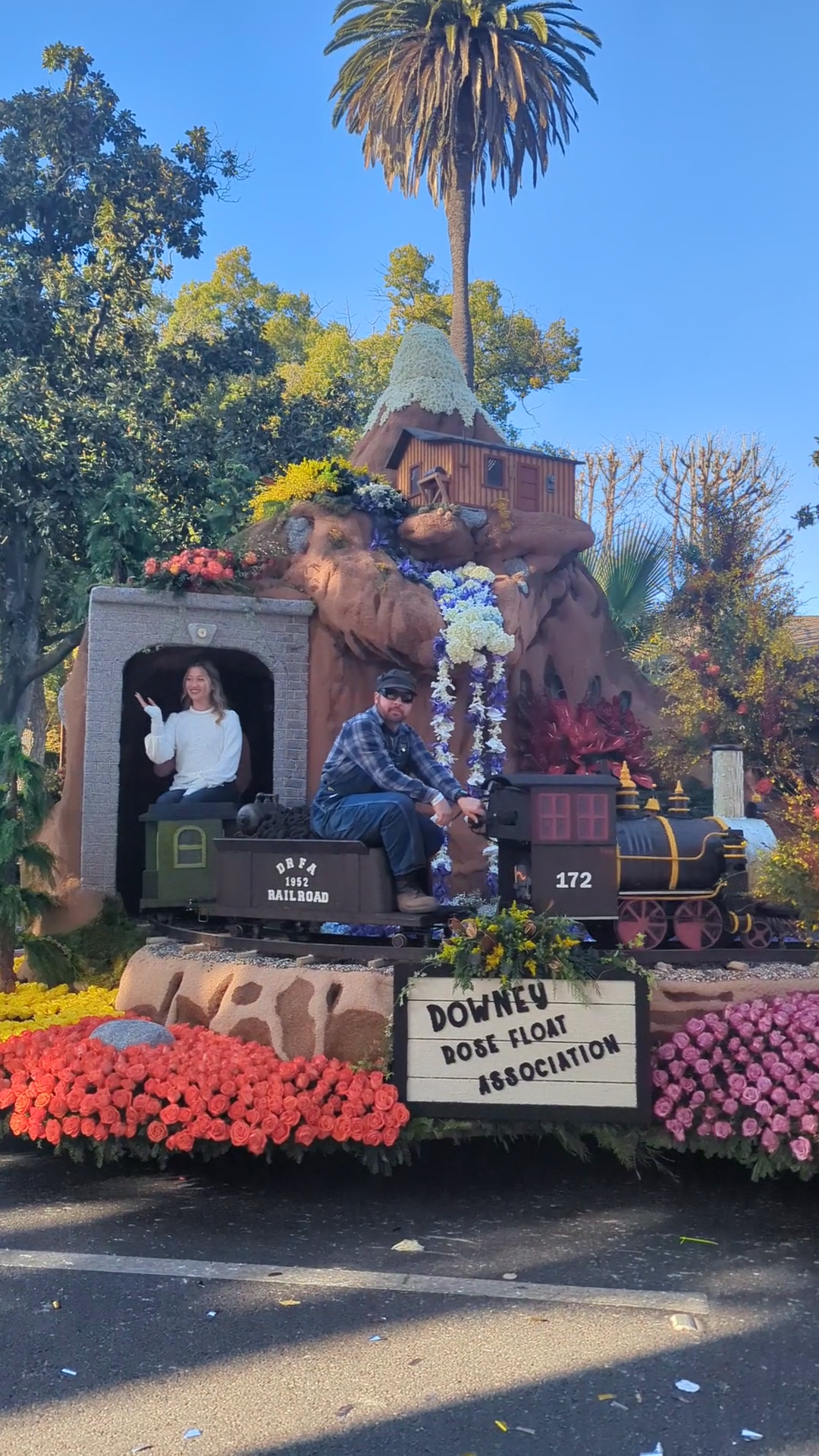Colorful miniature train-themed float created by the Downey Rose Float Association for the 2025 Rose Parade in Pasadena.